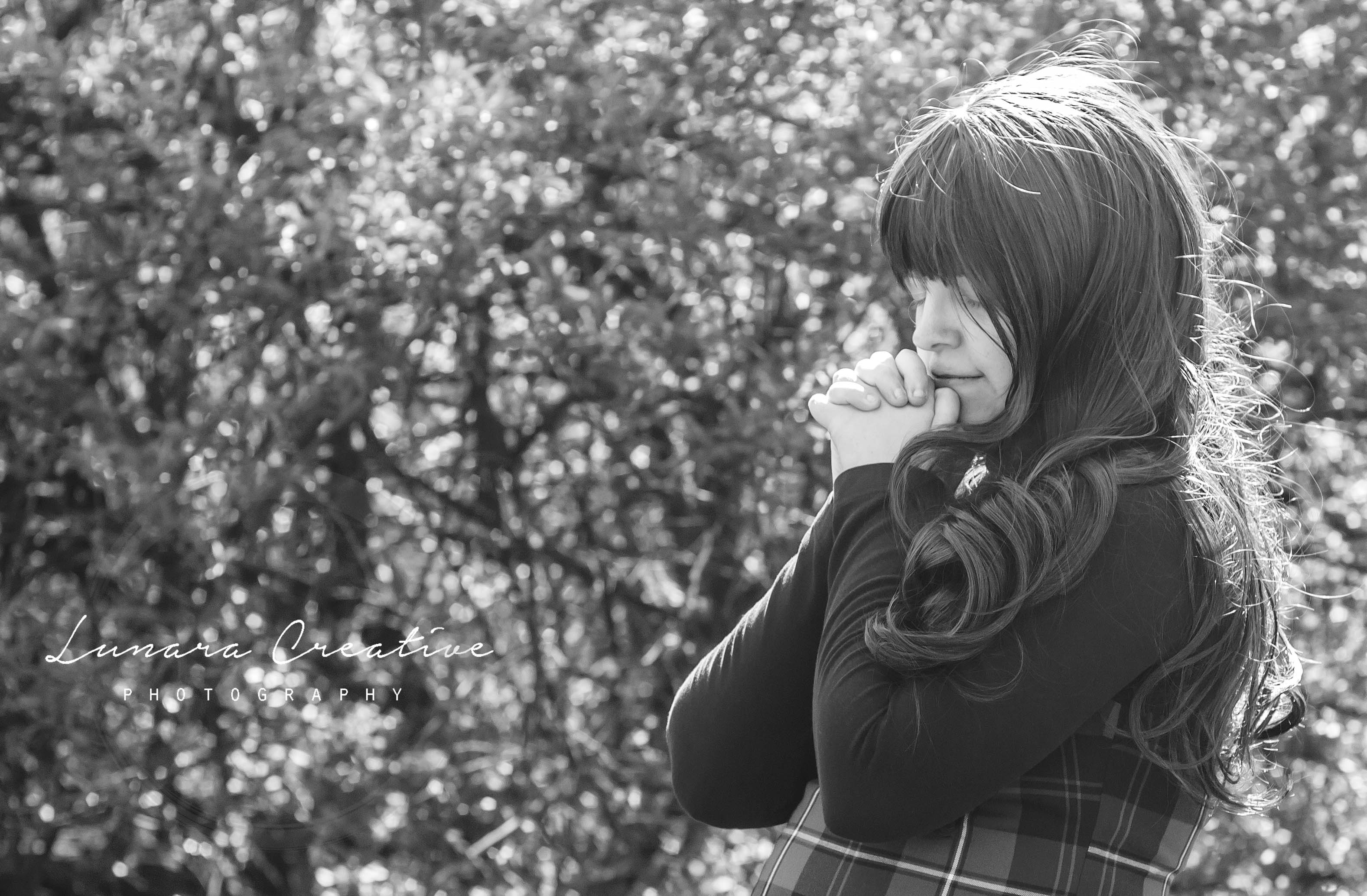 Prayer - A young woman saying a short pray in a field. by Lunara Creative Photography
